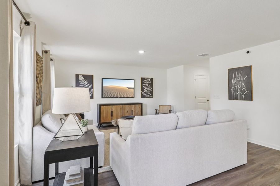 A living room with a white couch. A living room with a white couch.