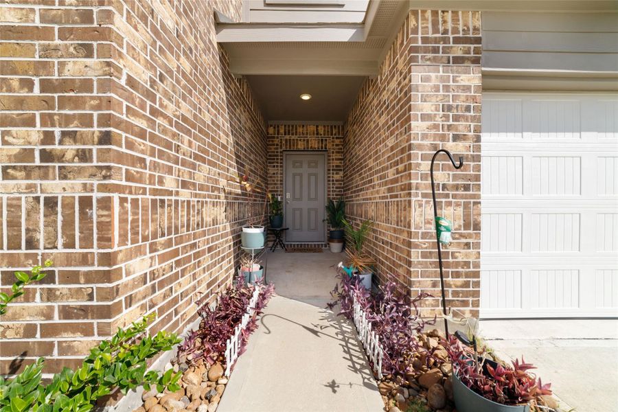 Exterior details and patio area of a home in Sunterra, Katy (Image 2).