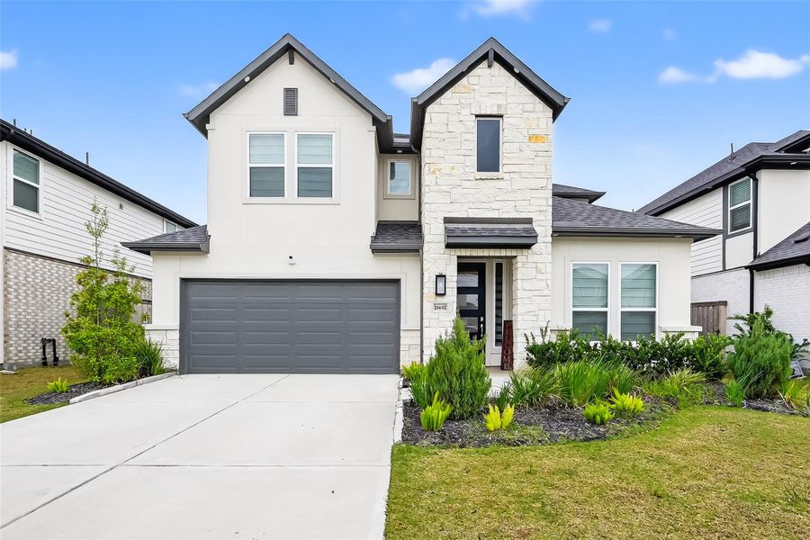 Front exterior of a new home in Avalon at Cypress, Cypress, TX, highlighting curb appeal (Image 24).