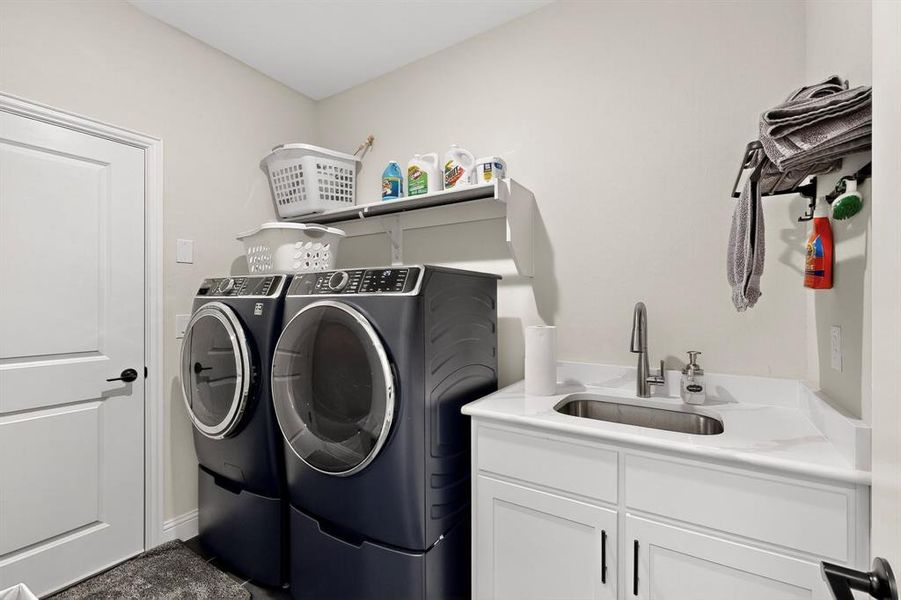 Washroom with washing machine and clothes dryer and cabinet space Washroom with washing machine and clothes dryer and cabinet space