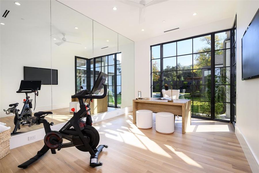 Workout room with recessed lighting and light wood finished floors Workout room with recessed lighting and light wood finished floors