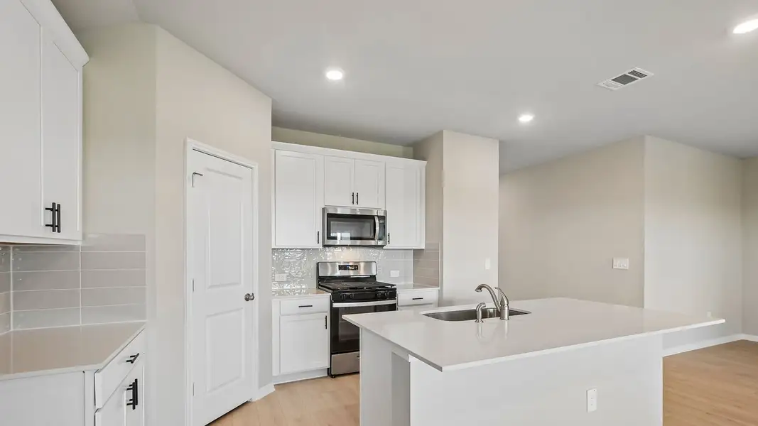 Furnished interior view inside a new home in Carillon, Manor (Image 9).