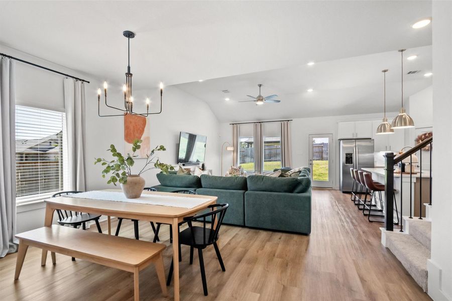 Bright, open-concept living at its best! The dining, living, and kitchen areas flow seamlessly together, creating an inviting space perfect for everyday living, entertaining, and gathering with family and friends.