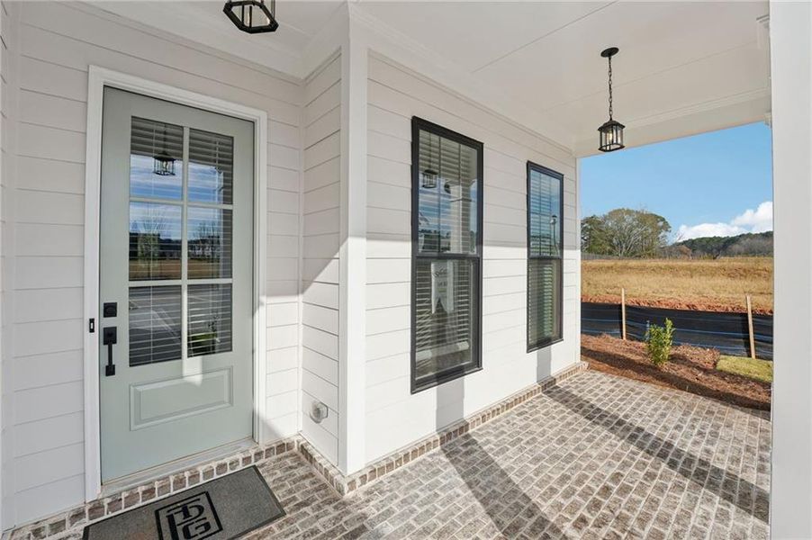 Exterior details and patio area of a home in Promenade at Sawnee Village, Cumming (Image 27).