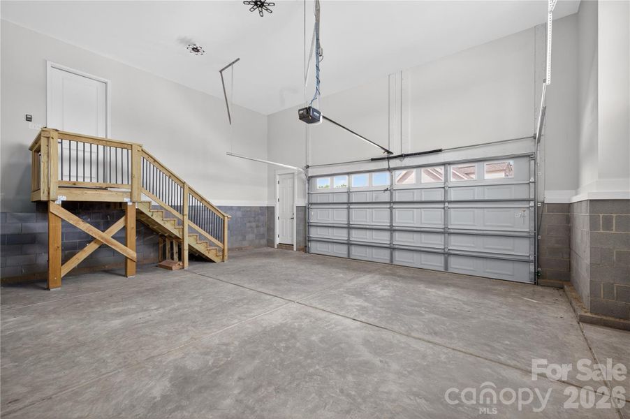 Not your average garage — extra high ceilings, tons of storage potential, and space for cars, tools, a home gym, golf cart, or weekend projects