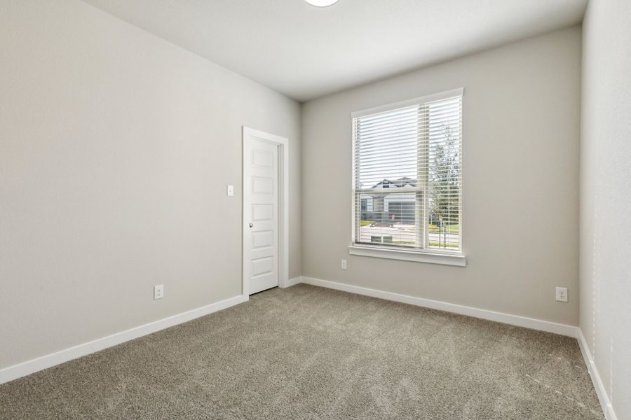 Bedroom in the Emmy II home plan by Trophy Signature Homes - REPRESENTATIVE PHOTO Bedroom in the Emmy II home plan by Trophy Signature Homes - REPRESENTATIVE PHOTO