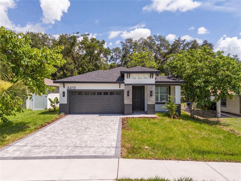 Front exterior of a new home in , Orlando, FL, highlighting curb appeal (Image 2). Front exterior of a new home in , Orlando, FL, highlighting curb appeal (Image 2).