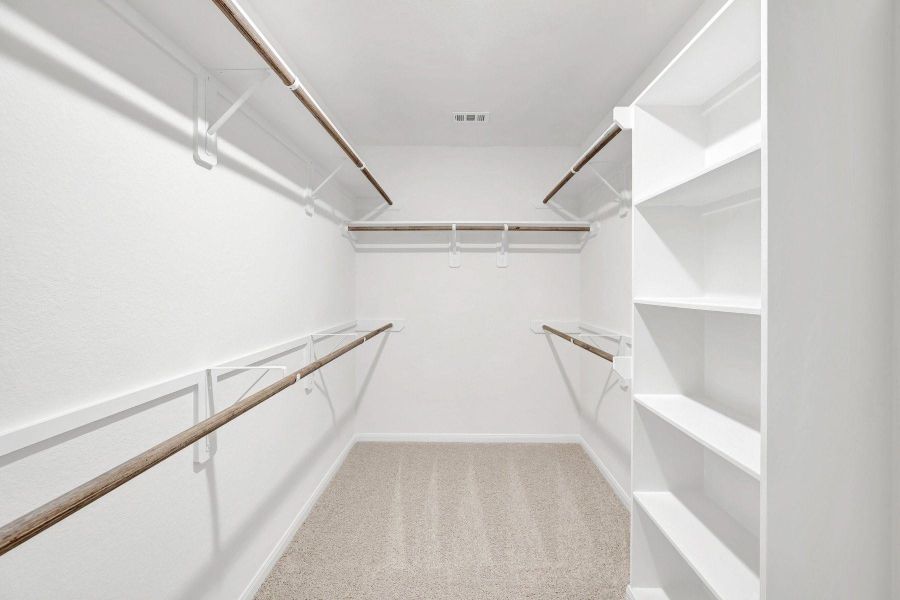 Owner's suite walk-in closet (*Photo not of actual home and used for illustration purposes only.)