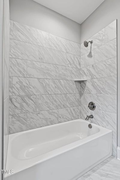 Full Bath tub with tiled walls