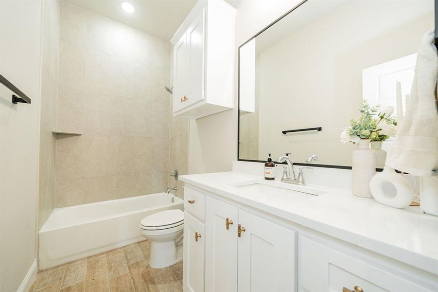 Full bath with vanity, shower / tub combination, and recessed lighting Full bath with vanity, shower / tub combination, and recessed lighting