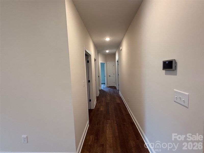 The same luxury vinyl plank flooring continues throughout the main level.