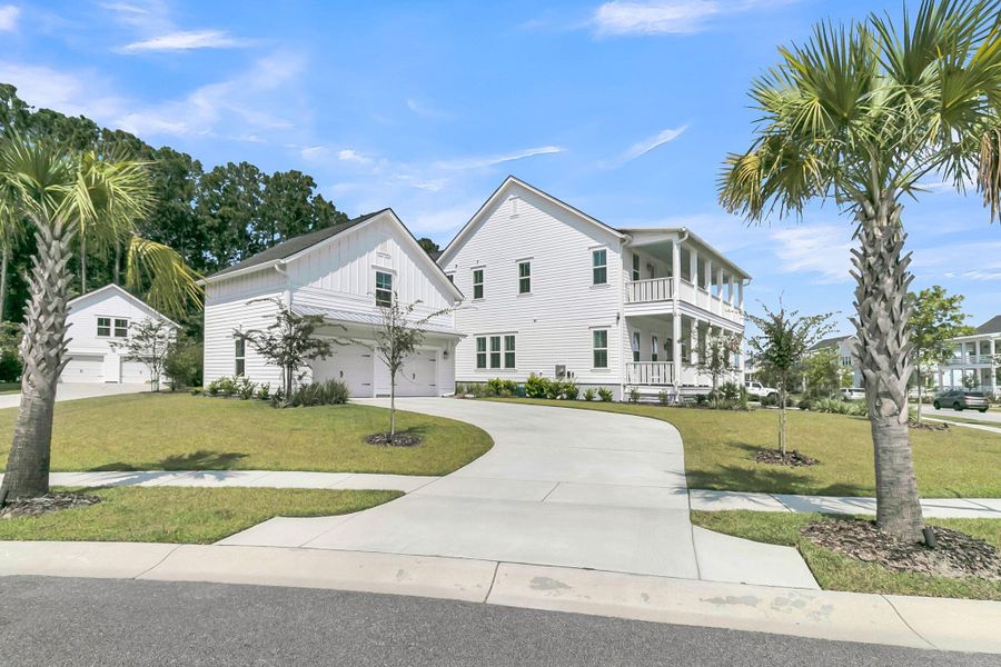 Front exterior of a new home in Carolina Park: Riverside, Mount Pleasant, SC, highlighting curb appeal (Image 2). Front exterior of a new home in Carolina Park: Riverside, Mount Pleasant, SC, highlighting curb appeal (Image 2).