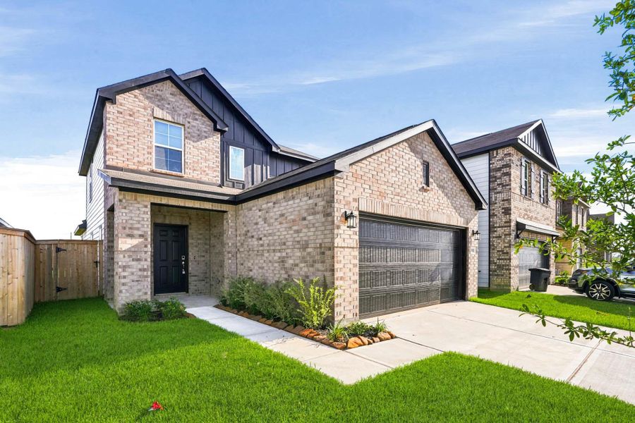 Front exterior of a new home in Sanford Farms, Waller, TX, highlighting curb appeal (Image 2). Front exterior of a new home in Sanford Farms, Waller, TX, highlighting curb appeal (Image 2).
