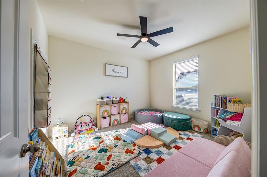 Game room featuring ceiling fan and carpet