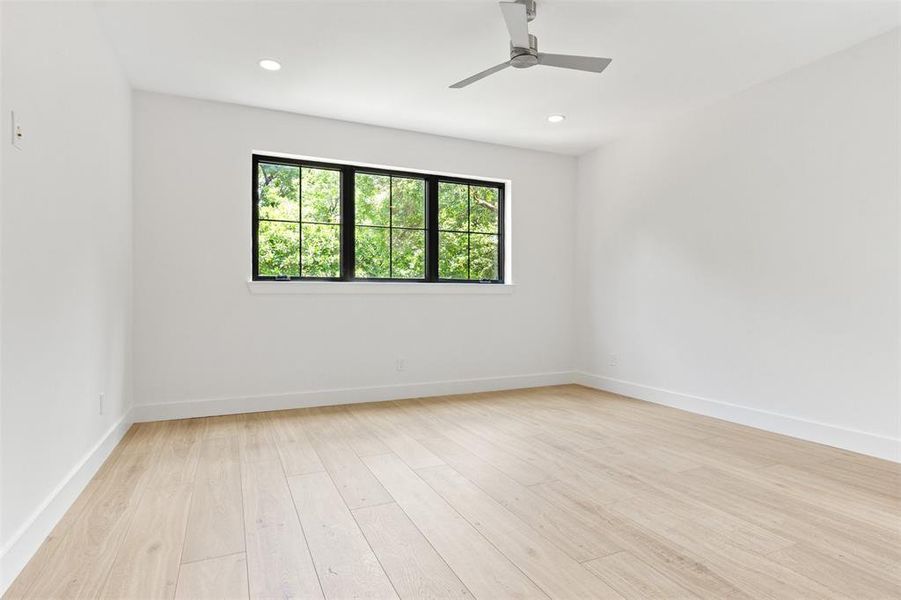 Unfurnished room with light wood-style floors, ceiling fan, and recessed lighting