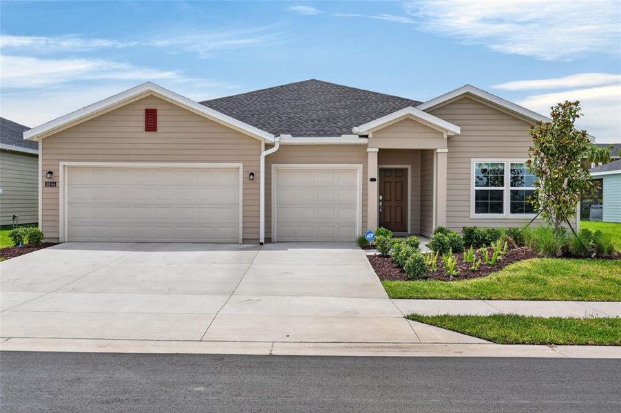 Front exterior of a new home in Pioneer Ranch, Ocala, FL, highlighting curb appeal (Image 25). Front exterior of a new home in Pioneer Ranch, Ocala, FL, highlighting curb appeal (Image 25).