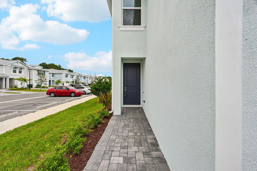 Front exterior of a new home in Tidewater, Fort Pierce, FL, highlighting curb appeal (Image 1). Front exterior of a new home in Tidewater, Fort Pierce, FL, highlighting curb appeal (Image 1).