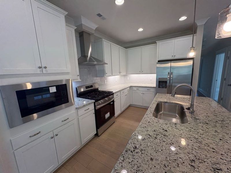 Furnished interior view inside a new home in Riverside Cove, Wilmington (Image 13). Furnished interior view inside a new home in Riverside Cove, Wilmington (Image 13).
