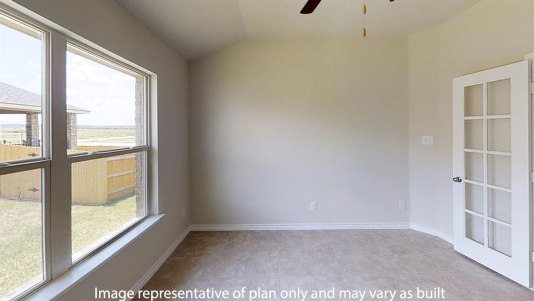 Empty room featuring lofted ceiling and a ceiling fan Empty room featuring lofted ceiling and a ceiling fan