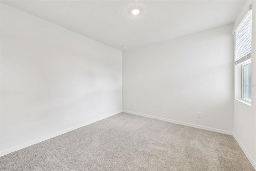 Spacious, unfurnished interior of a new home in Ridgehaven - Villas, Ormond Beach (Image 28).