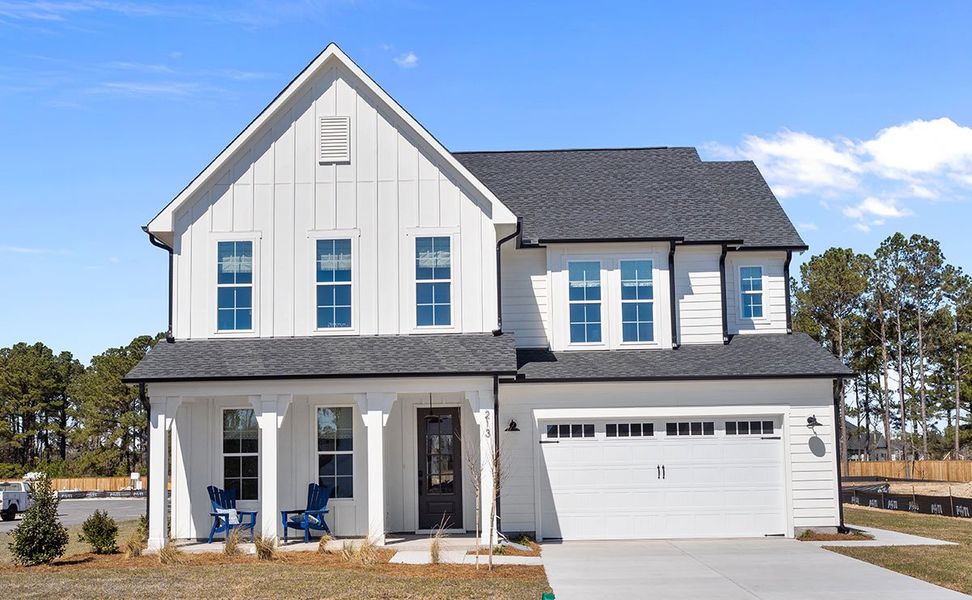 Representative exterior photo of a completed home built from the The Hampton by RobuckHomes in Windwater, Hampstead, NC (Image 27).