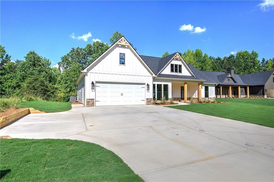 Front exterior of a new home in , Dallas, GA, highlighting curb appeal (Image 20).