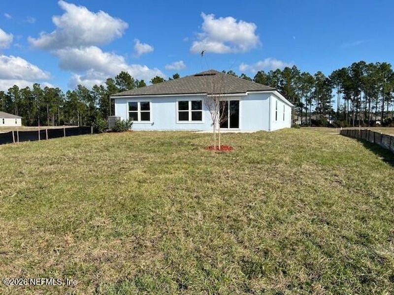 Exterior details and patio area of a home in Sawmill Branch, Palm Coast (Image 2).