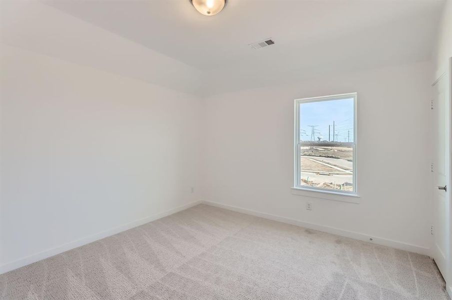 View of carpeted spare room