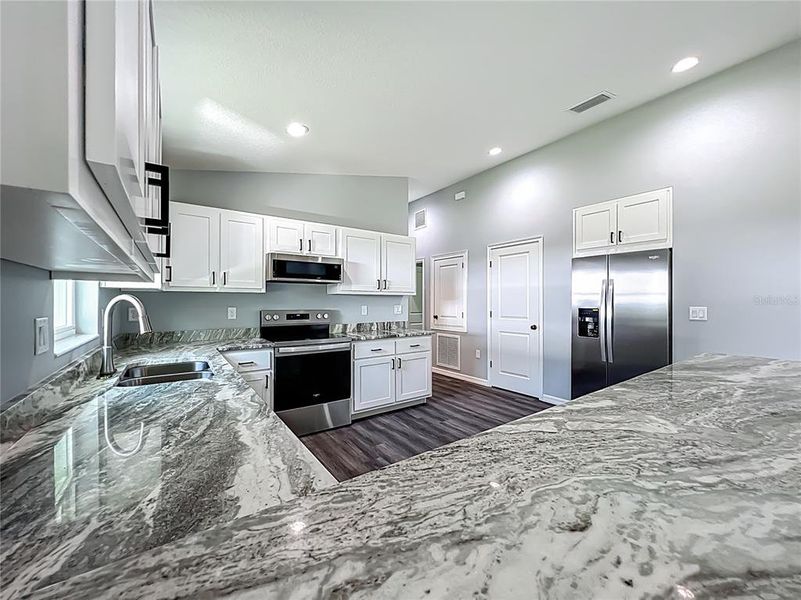 Furnished interior view inside a new home in , Lake Panasoffkee (Image 10).