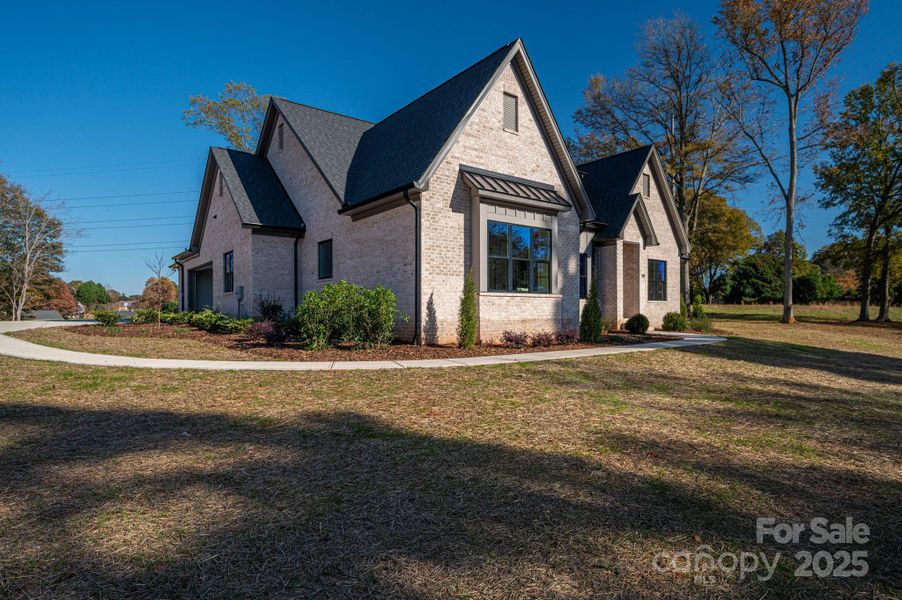 Front exterior of a new home in , Belmont, NC, highlighting curb appeal (Image 26).