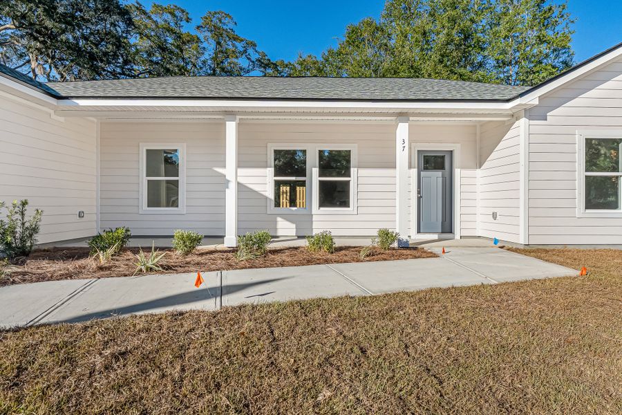 Exterior details and patio area of a home in Live Oak Cottages, Freeport (Image 3). Exterior details and patio area of a home in Live Oak Cottages, Freeport (Image 3).