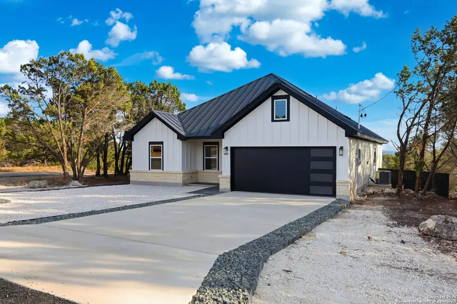 Front exterior of a new home in , Spring Branch, TX, highlighting curb appeal (Image 1). Front exterior of a new home in , Spring Branch, TX, highlighting curb appeal (Image 1).