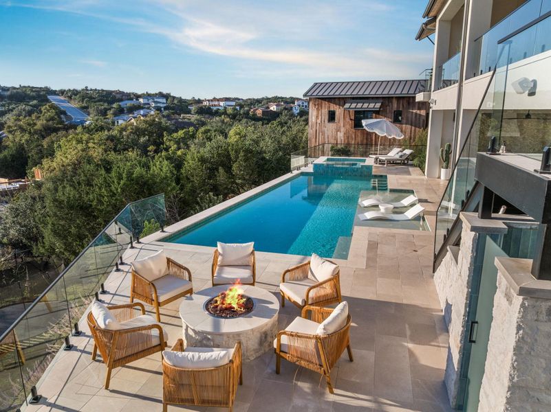 View of pool featuring a patio, a pool with connected hot tub, and an outdoor fire pit View of pool featuring a patio, a pool with connected hot tub, and an outdoor fire pit