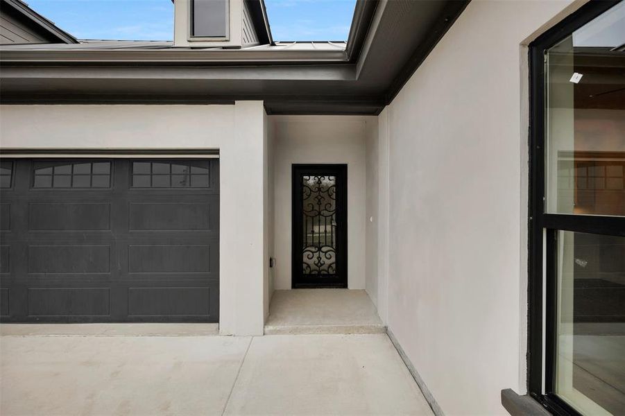 Property entrance with stucco siding Property entrance with stucco siding