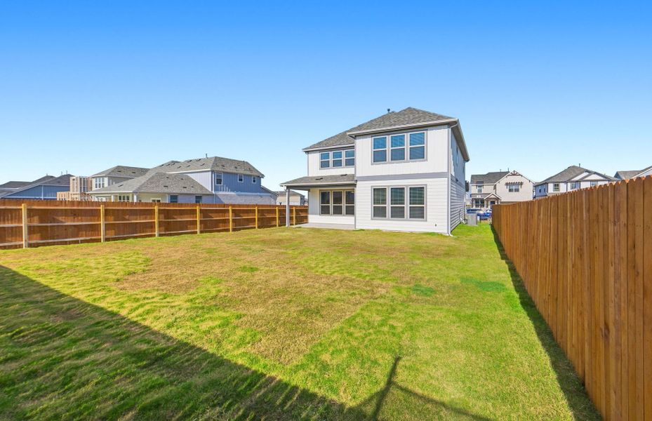 Exterior details and patio area of a home in Santa Rita Ranch, Liberty Hill (Image 32). Exterior details and patio area of a home in Santa Rita Ranch, Liberty Hill (Image 32).