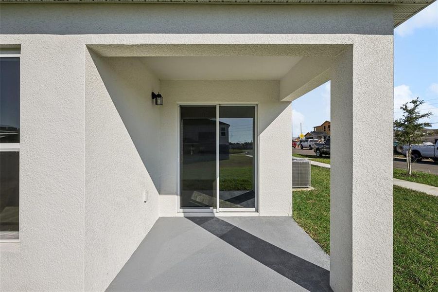 Exterior details and patio area of a home in The Enclave at Scenic Terrace, Haines City (Image 4).