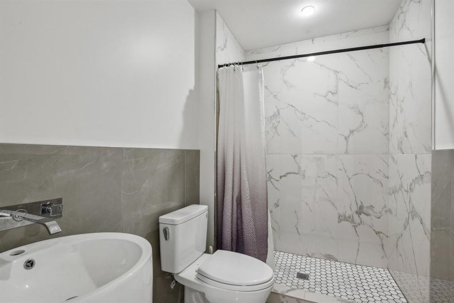 Secondary bathroom with walk-in shower.