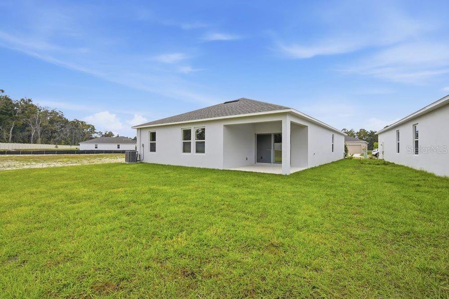 Exterior details and patio area of a home in Palm Wind, Hudson (Image 18).
