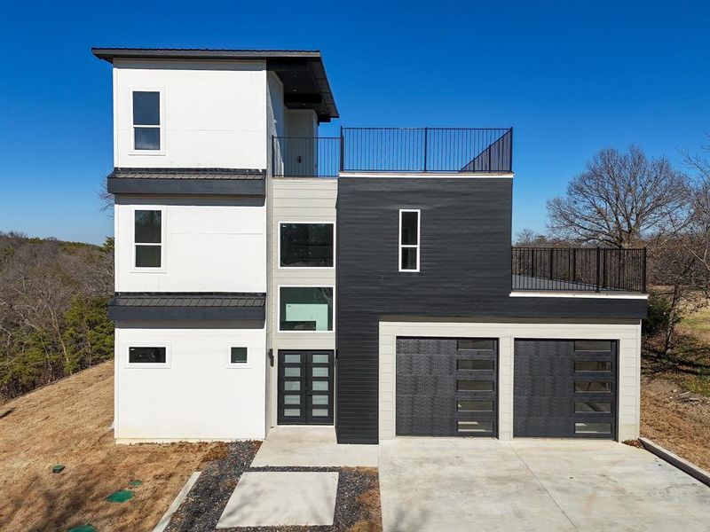 Front exterior of a new home in , Pottsboro, TX, highlighting curb appeal (Image 26).
