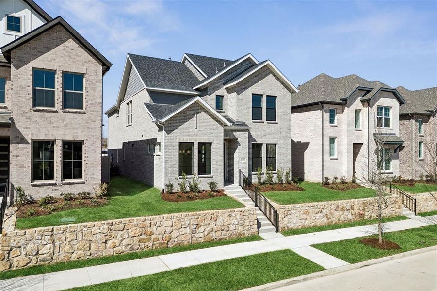 Featuring beautiful, neutral color brick, complementary trim, striking gables and lovely stone wall, you'll enjoy wonderful curb appeal in this dream home! Featuring beautiful, neutral color brick, complementary trim, striking gables and lovely stone wall, you'll enjoy wonderful curb appeal in this dream home!