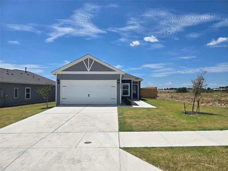 Front exterior of a new home in Big Sky Estates, Ponder, TX, highlighting curb appeal (Image 2).