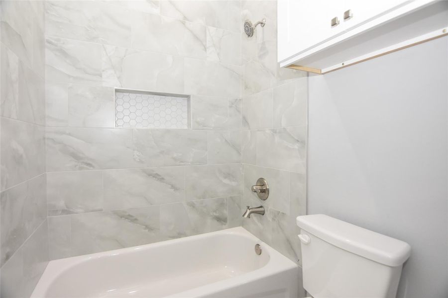 Second full bath with separate toilet and tub area Second full bath with separate toilet and tub area