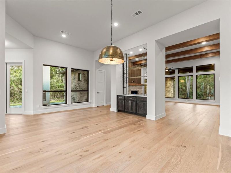 Formal Dining with Engineered Hardwood Flooring and Custom Wine Rack