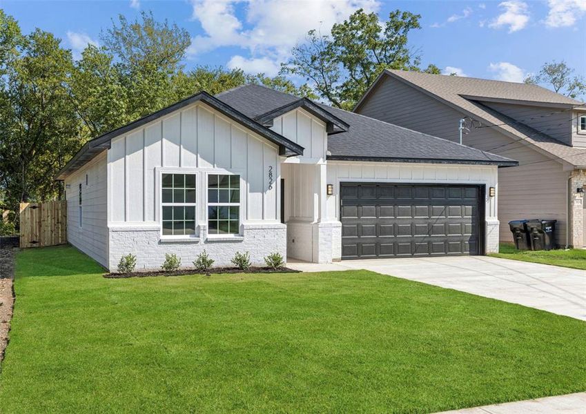 Modern farmhouse style home featuring a shingled roof, an attached garage, board and batten siding, concrete driveway, and brick siding