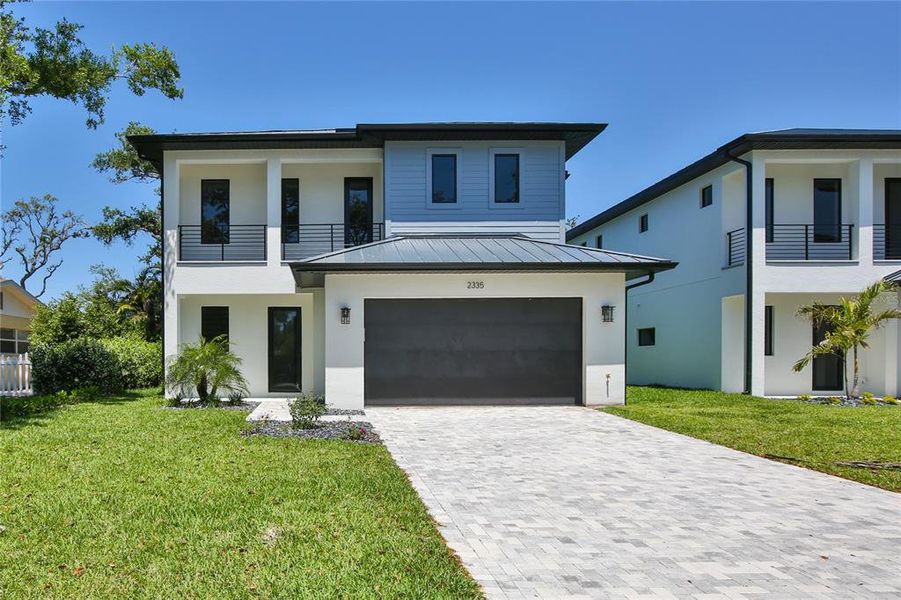 Front exterior of a new home in , Sarasota, FL, highlighting curb appeal (Image 1). Front exterior of a new home in , Sarasota, FL, highlighting curb appeal (Image 1).