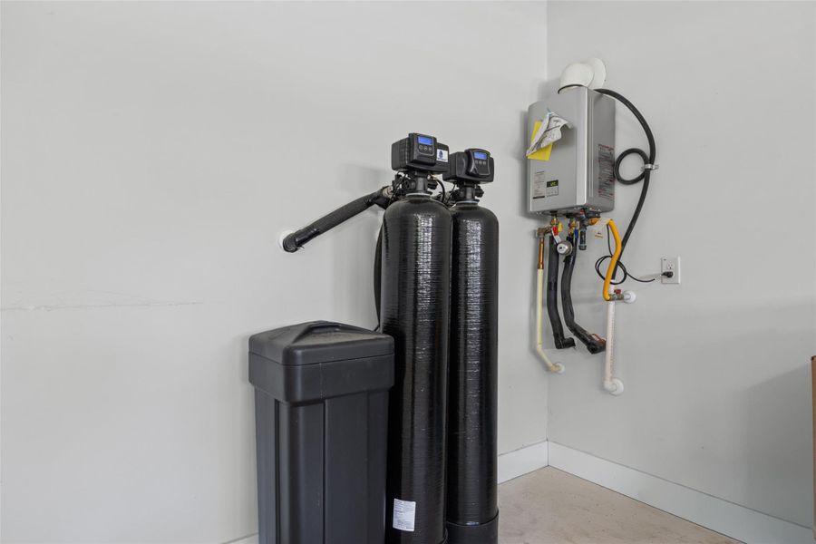 Essential home systems, including a water heater and water treatment units, neatly installed.