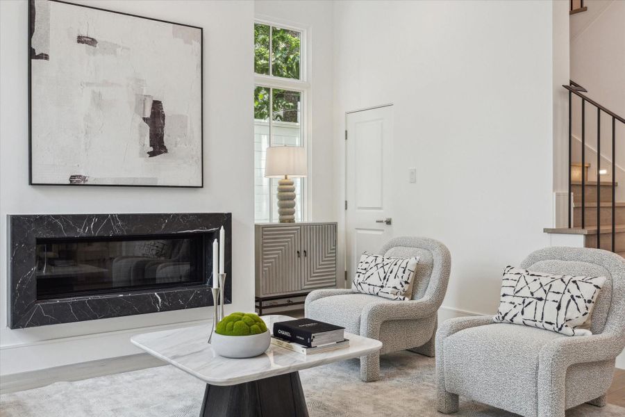 Linear floating fireplace with stone surround is another one of the many upgrade options available to make this space your own. Linear floating fireplace with stone surround is another one of the many upgrade options available to make this space your own.