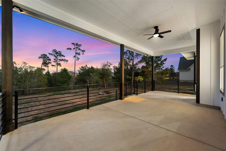 Patio terrace at dusk featuring a ceiling fan and a patio area