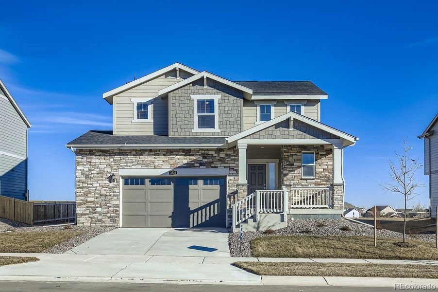 Front exterior of a new home in Riano Ridge, Loveland, CO, highlighting curb appeal (Image 1). Front exterior of a new home in Riano Ridge, Loveland, CO, highlighting curb appeal (Image 1).