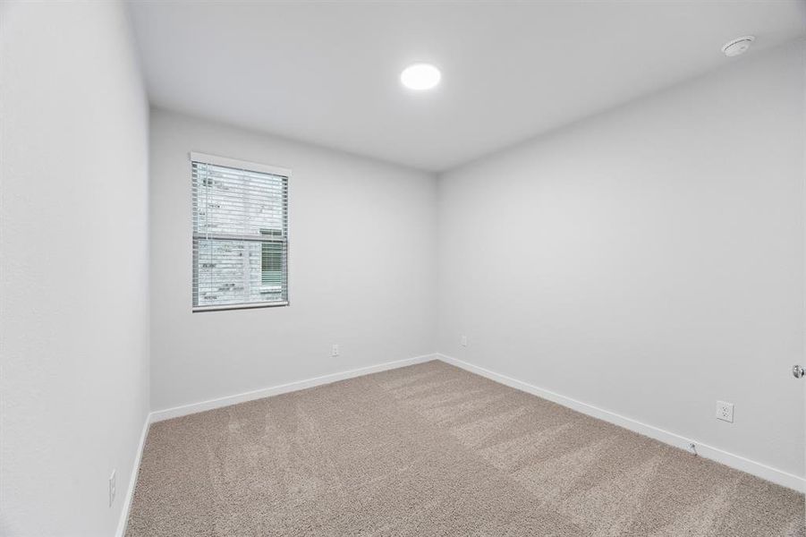 Bedroom in the Cedar home plan by Trophy Signature Homes – REPRESENTATIVE PHOTO